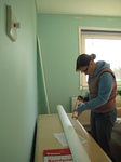 SX17193 Jenni DIYing putting up coving in bedroom.jpg